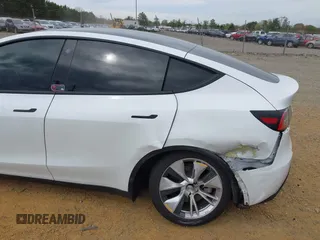 2021 Tesla Model Y Long Range with VIN 5YJYGDEE6MF122363, listed as a IAAI auction lot 41952018 with 54,263 mi miles and . Bid and sale history available at carsss.com. Image 6.