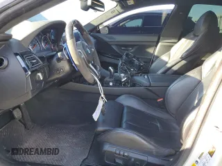 2017 BMW M6 z VIN WBS6E9C56HG437410, wystawiony jako Copart lot #80217694 z przebiegiem 68 335 mil mil oraz Szkoda całkowita • Salvage title. Historia ofert i sprzedaży dostępna na DreamBid. Obrazek 7.