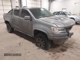 2019 Chevrolet Colorado 4WD ZR2 z VIN 1GCGTEEN0K1284783, wystawiony jako IAAI lot #41484593 z przebiegiem 137 000 mil mil oraz . Historia ofert i sprzedaży dostępna na DreamBid. Obrazek 1.