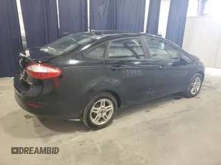 2019 Ford Fiesta SE z VIN 3FADP4BJ9KM151046, wystawiony jako Copart lot #56862255 z przebiegiem 77 002 mil mil oraz Tytuł czysty. Historia ofert i sprzedaży dostępna na DreamBid. Obrazek 3.