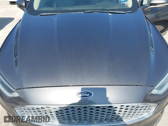 2019 Ford Fusion Titanium with VIN 3FA6P0D91KR104827, listed as a IAAI auction lot 42221526 with 141,316 mi miles and . Bid and sale history available at DreamBid. Image 6.