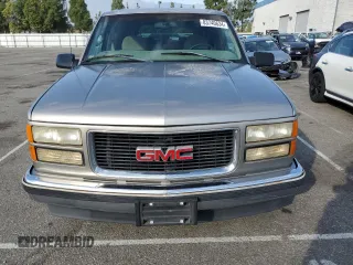 1999 GMC Suburban with VIN 3GKEC16R0XG526194, listed as a Copart auction lot 83740634 with 199,583 mi miles and Clean title. Bid and sale history available at DreamBid. Image 5.