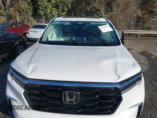 2024 Honda Pilot Touring with VIN 5FNYG2H7XRB016877, listed as a IAAI auction lot 41496013 with 18,213 mi miles and . Bid and sale history available at DreamBid. Image 6.