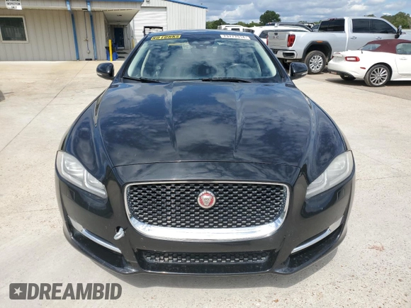 2018 Jaguar XJ with VIN SAJWA1C76J8W14271, listed as a Copart auction lot 73777914 with 124,155 mi miles and Salvage Title. Bid and sale history available at carsss.com. Image 5.