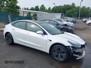 2021 Tesla Model 3 Standard Range Plus z VIN 5YJ3E1EA8MF062940, wystawiony jako IAAI lot #42446118 z przebiegiem 31 246 mil mil oraz . Historia ofert i sprzedaży dostępna na DreamBid. Obrazek 1.
