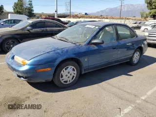 2001 Saturn SL z VIN 1G8ZF52861Z275529, wystawiony jako Copart lot #74153154 z przebiegiem 171 272 mil mil oraz Tytuł czysty. Historia ofert i sprzedaży dostępna na DreamBid. Obrazek 1.