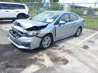 2017 Subaru Impreza Premium with VIN 4S3GKAB61H3601363, listed as a IAAI auction lot 42534427 with 86,617 mi miles and . Bid and sale history available at DreamBid. Image 2.