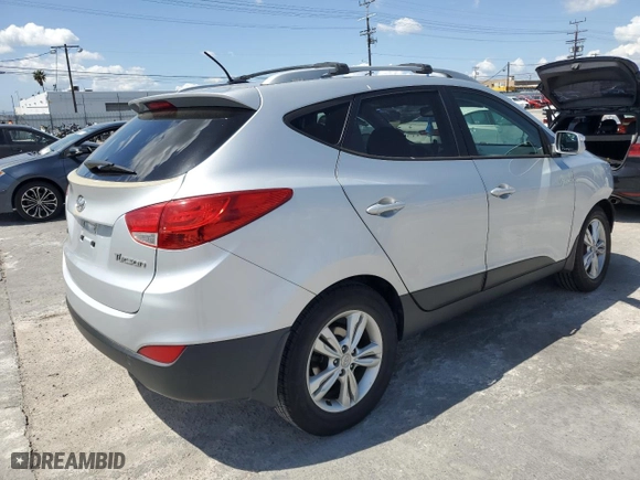 2013 Hyundai Tucson GLS with VIN KM8JU3AC5DU658281, listed as a Copart auction lot 51577995 with 136,373 mi miles and Salvage Title. Bid and sale history available at carsss.com. Image 3.