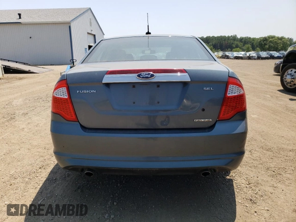 2012 Ford Fusion SEL z VIN 3FAHP0JG7CR332022, wystawiony jako Copart lot #60785765 z przebiegiem 112 202 mil mil oraz Szkoda całkowita • Salvage title. Historia ofert i sprzedaży dostępna na DreamBid. Obrazek 6.