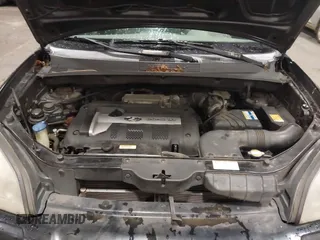 2006 Hyundai Tucson GL with VIN KM8JM12B26U325338, listed as a IAAI auction lot 41809578 with 127,210 mi miles. Bid and sale history available at carsss.com. Image 10.