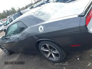 2014 Dodge Challenger R/T z VIN 2C3CDYBT7EH293104, wystawiony jako IAAI lot #41452435 z przebiegiem 49 728 mil mil oraz . Historia ofert i sprzedaży dostępna na DreamBid. Obrazek 14.