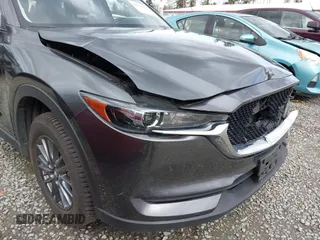 2021 Mazda CX-5 Touring with VIN JM3KFBCM2M0484011, listed as a IAAI auction lot 41825954 with 48,958 mi miles. Bid and sale history available at carsss.com. Image 6.