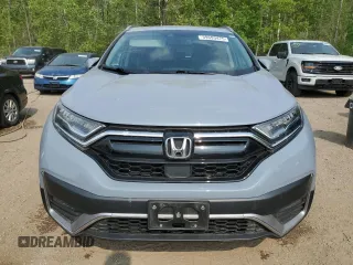 2020 Honda CR-V Touring z VIN 2HKRW2H9XLH236764, wystawiony jako Copart lot #59693475 z przebiegiem Nie podano mil oraz Czysty tytuł • Clean title. Historia ofert i sprzedaży dostępna na DreamBid. Obrazek 5.