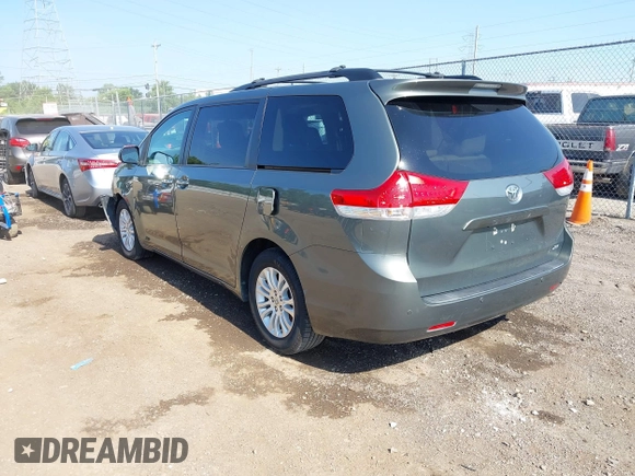 2014 Toyota Sienna XLE with VIN 5TDYK3DC6ES414892, listed as a IAAI auction lot 42545666 with 135,805 mi miles and . Bid and sale history available at DreamBid. Image 3.