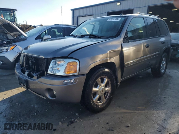 2005 GMC Envoy SLT with VIN 1GKDS13SX52322725, listed as a Copart auction lot 82032674 with 249,288 mi miles and Salvage Title. Bid and sale history available at carsss.com. Image 1.