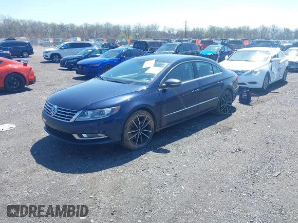 2014 Volkswagen CC Sport z VIN WVWBN7AN7EE511759, wystawiony jako IAAI lot #42002504 z przebiegiem 111 900 mil mil oraz . Historia ofert i sprzedaży dostępna na DreamBid. Obrazek 2.