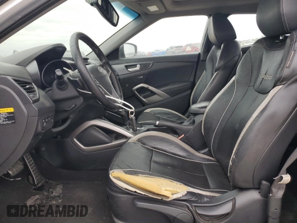 2013 Hyundai Veloster Turbo z VIN KMHTC6AE2DU158240, wystawiony jako Copart lot #54719205 z przebiegiem 147 652 mil mil oraz Szkoda całkowita • Salvage title. Historia ofert i sprzedaży dostępna na DreamBid. Obrazek 7.