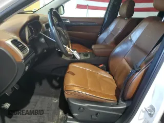 2015 Jeep Grand Cherokee Summit with VIN 1C4RJFJG1FC226591, listed as a Copart auction lot 52926115 with 130,803 mi miles and Salvage Title. Bid and sale history available at DreamBid. Image 7.