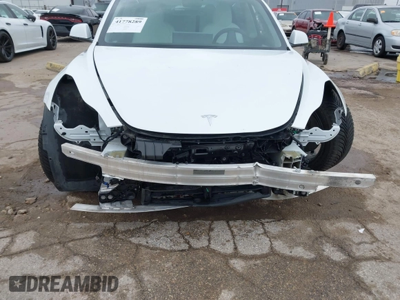 2021 Tesla Model 3 Long Range with VIN 5YJ3E1EB3MF059713, listed as a IAAI auction lot 41778289 with 52,211 mi miles. Bid and sale history available at carsss.com. Image 6.