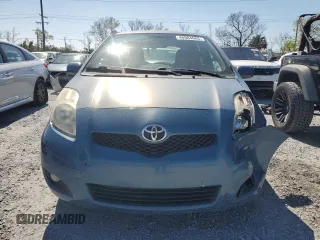 2011 Toyota Yaris with VIN JTDJT4K35B5330328, listed as a Copart auction lot 46904665 with 107,100 mi miles and Salvage Title. Bid and sale history available at carsss.com. Image 5.