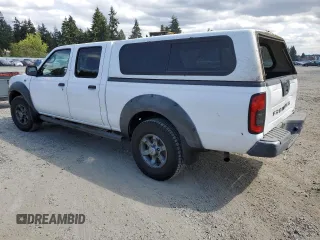 2003 Nissan Frontier XE with VIN 1N6ED29X13C419979, listed as a Copart auction lot 65806585 with 167,535 mi miles and Salvage title. Bid and sale history available at DreamBid. Image 2.