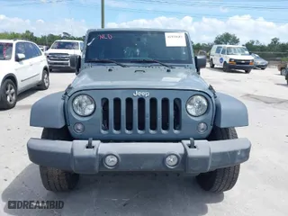 2015 Jeep Wrangler Unlimited Willys Wheeler with VIN 1C4BJWDG2FL730323, listed as a IAAI auction lot 41958605 with 75,192 mi miles. Bid and sale history available at carsss.com. Image 12.