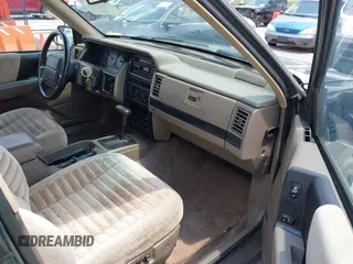 1995 Jeep Grand Cherokee Laredo with VIN 1J4FX58S0SC716398, listed as a IAAI auction lot 42647346 with 58,184 mi miles and . Bid and sale history available at DreamBid. Image 5.