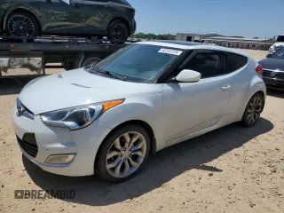 2013 Hyundai Veloster w/Gray Int z VIN KMHTC6AD4DU129913, wystawiony jako Copart lot #52252225 z przebiegiem 90 113 mil mil oraz Czysty tytuł • Clean title. Historia ofert i sprzedaży dostępna na DreamBid. Obrazek 1.