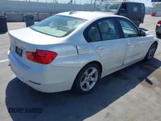 2013 BMW 3 Series 328i with VIN WBA3A5C51DF352812, listed as a IAAI auction lot 41974158 with 176,951 mi miles. Bid and sale history available at carsss.com. Image 4.