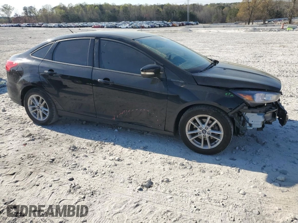 2017 Ford Focus SE with VIN 1FADP3F26HL331253, listed as a Copart auction lot 50869865 with 60,776 mi miles and Salvage title. Bid and sale history available at DreamBid. Image 4.