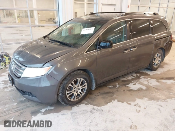2012 Honda Odyssey EX-L with VIN 5FNRL5H66CB127507, listed as a IAAI auction lot 41961465 with 228,972 mi miles and . Bid and sale history available at carsss.com. Image 18.