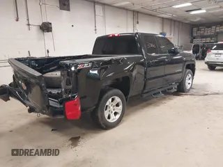 2017 Chevrolet Silverado 1500 LT with VIN 1GCVKREC0HZ384747, listed as a IAAI auction lot 37311343 with 67,390 mi miles. Bid and sale history available at carsss.com. Image 4.