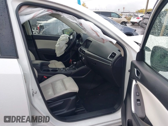 2016 Mazda CX-5 Grand Touring with VIN JM3KE4DY0G0705691, listed as a IAAI auction lot 40880798 with 130,624 mi miles. Bid and sale history available at carsss.com. Image 5.