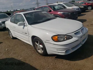 1999 Pontiac Grand Am GT with VIN 1G2NW12E0XM853038, listed as a Copart auction lot 69262194 with 162,986 mi miles and Salvage Title. Bid and sale history available at carsss.com. Image 4.