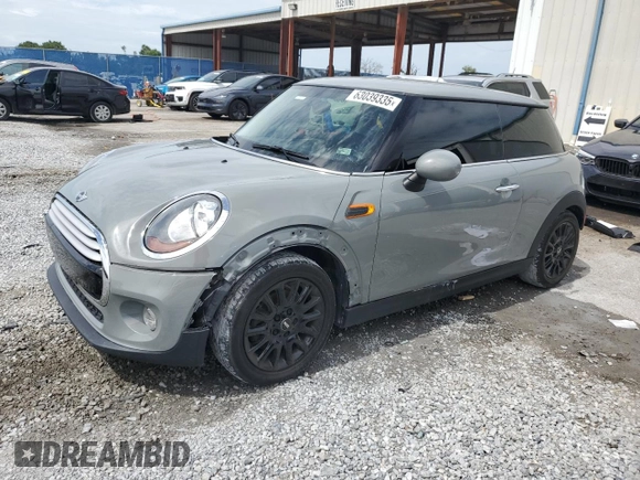 2014 MINI Hardtop with VIN WMWXM5C51ET934047, listed as a Copart auction lot 63039335 with 104,446 mi miles and Salvage title. Bid and sale history available at DreamBid. Image 1.