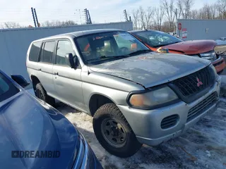 2001 Mitsubishi Montero ES z VIN JA4MT21H91P037463, wystawiony jako IAAI lot #41463766 z przebiegiem 147 952 mil mil oraz . Historia ofert i sprzedaży dostępna na DreamBid. Obrazek 1.