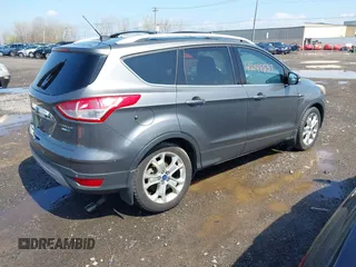 2014 Ford Escape Titanium with VIN 1FMCU9J99EUA75276, listed as a IAAI auction lot 42148537 with 163,330 mi miles and . Bid and sale history available at DreamBid. Image 4.