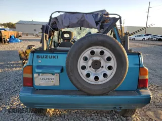 1992 Suzuki Sidekick z VIN 2S3TC01C2N6405497, wystawiony jako Copart lot #75856164 z przebiegiem 38 423 mil mil oraz Szkody całkowita. Historia ofert i sprzedaży dostępna na DreamBid. Obrazek 6.