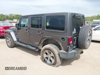2017 Jeep Wrangler Unlimited Sahara with VIN 1C4BJWEGXHL595724, listed as a IAAI auction lot 42018264 with 95,948 mi miles. Bid and sale history available at carsss.com. Image 3.