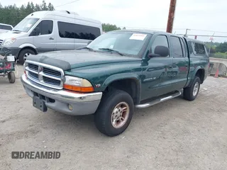 2000 Dodge Dakota Sport z VIN 1B7GG2AN4YS760836, wystawiony jako IAAI lot #42472312 z przebiegiem 230 401 mil mil oraz . Historia ofert i sprzedaży dostępna na DreamBid. Obrazek 2.
