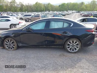 2021 Mazda 3 Premium z VIN 3MZBPADL2MM254467, wystawiony jako IAAI lot #42151557 z przebiegiem 63 282 mil mil oraz . Historia ofert i sprzedaży dostępna na DreamBid. Obrazek 15.