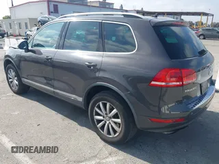 2011 Volkswagen Touareg Sport with VIN WVGFF9BP3BD002517, listed as a IAAI auction lot 42174143 with 156,337 mi miles and . Bid and sale history available at DreamBid. Image 3.