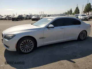 2012 BMW 7 Series 740Li with VIN WBAKB4C55CC575826, listed as a Copart auction lot 74012564 with 140,577 mi miles and Salvage Title. Bid and sale history available at carsss.com. Image 1.