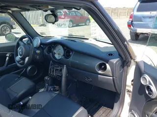 2006 MINI Hardtop S with VIN WMWRE33596TJ37959, listed as a IAAI auction lot 42635457 with 124,440 mi miles and . Bid and sale history available at DreamBid. Image 5.