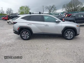 2022 Hyundai Tucson Blue z VIN KM8JBCA13NU077934, wystawiony jako IAAI lot #41920832 z przebiegiem 59 579 mil mil oraz . Historia ofert i sprzedaży dostępna na DreamBid. Obrazek 13.