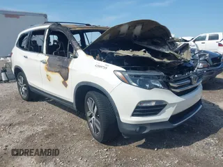 2017 Honda Pilot Touring with VIN 5FNYF6H98HB102022, listed as a IAAI auction lot 42009719 with Not provided miles and . Bid and sale history available at DreamBid. Image 1.
