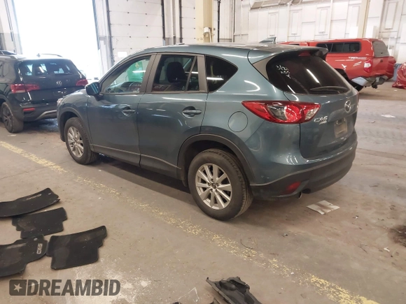 2016 Mazda CX-5 Touring z VIN JM3KE4CY2G0839202, wystawiony jako IAAI lot #41901207 z przebiegiem 65 449 mil mil oraz . Historia ofert i sprzedaży dostępna na DreamBid. Obrazek 3.