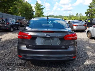 2018 Ford Focus SE z VIN 1FADP3FE0JL284107, wystawiony jako IAAI lot #42815845 z przebiegiem 110 155 mil mil oraz . Historia ofert i sprzedaży dostępna na DreamBid. Obrazek 16.
