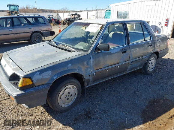 1985 Honda Civic z VIN JHMAK5433FS009299, wystawiony jako IAAI lot #41576709 z przebiegiem 152 094 mil mil oraz . Historia ofert i sprzedaży dostępna na DreamBid. Obrazek 2.