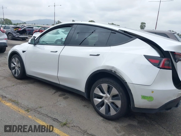 2023 Tesla Model Y Long Range with VIN 7SAYGAEE9PF702910, listed as a IAAI auction lot 42199519 with 91,094 mi miles and . Bid and sale history available at DreamBid. Image 14.